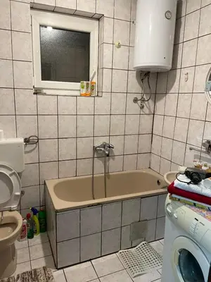 a bathroom with a tub and a toilet and a sink at Apartment Old Town Visoko in Visoko