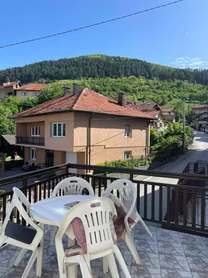 a white table and chairs sitting on a balcony at Apartment Old Town Visoko in Visoko