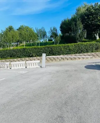 a parking lot with a fence and a street at Happy Dreams Oasis Cazin, Modernes Apartment 60m2, WiFi & Balkon in Cazin