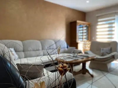 a living room with a couch and a table at Apartman Nani in Bihać