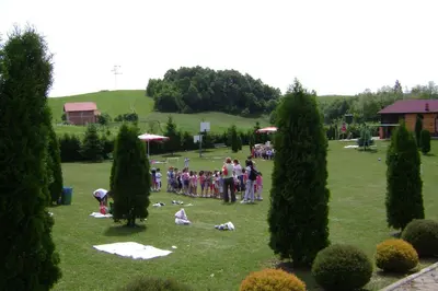 a group of people standing in a park at Resort Čokori in Banja Luka