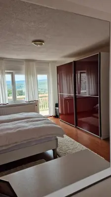 a bedroom with a large bed with a large mirror at Holiday Home Gredina in Livno