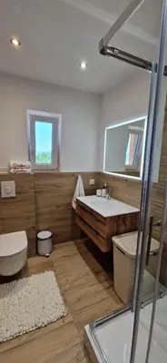 a bathroom with a tub and a toilet and a sink at Holiday Home Gredina in Livno