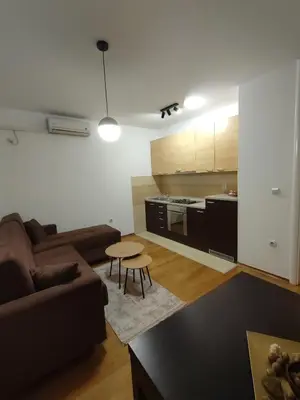 a living room with a couch and a table at Apartman Amabilis in Banja Luka