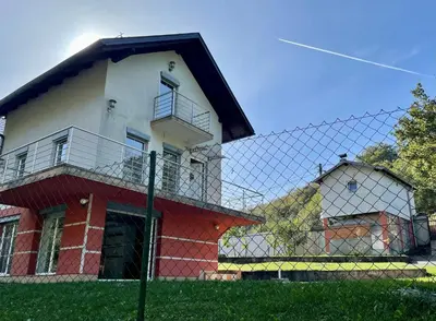 a house with a fence in front of it at 069 Riverside Vikendica - Banja Luka in Rekavice