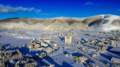 an aerial view of a town in the snow at Apartment Kupres in Kupres