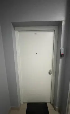 a white door in a room with a wall at Alex apartment in Banja Luka