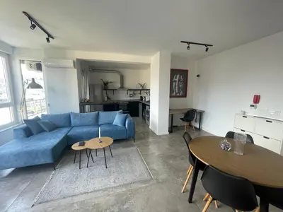 a living room with a blue couch and a table at Alex apartment in Banja Luka