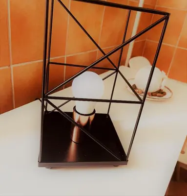 a black stand with a candle on a counter at Apartman Maric in Drvar