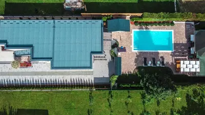 an overhead view of a building with a swimming pool at Delta apartments in Bihać