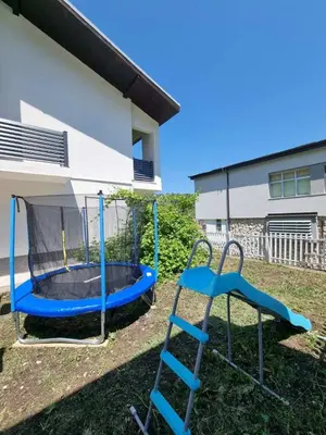a playground with a slide and a trampoline at Apartman CENTAR 1 in Jajce
