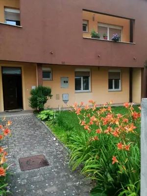 a building with flowers in front of it at Bolek mansion in Banja Luka