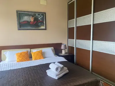 a bedroom with a bed with towels on it at Bolek mansion in Banja Luka