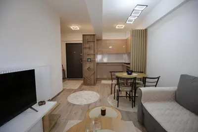 a living room with a couch and a table at Apartman Hana Fojnica in Fojnica