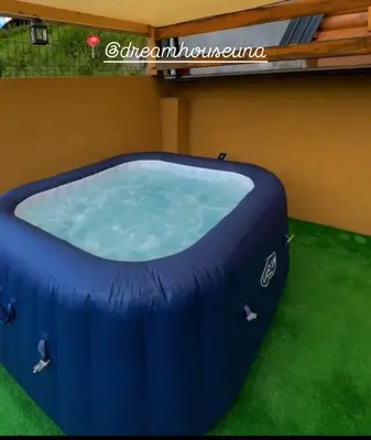 a large blue inflatable hot tub in a yard at Dream House Una in Orašac