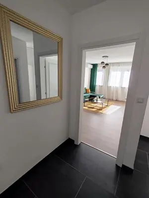 a mirror on a wall in a room at Pinocchio in Bihać