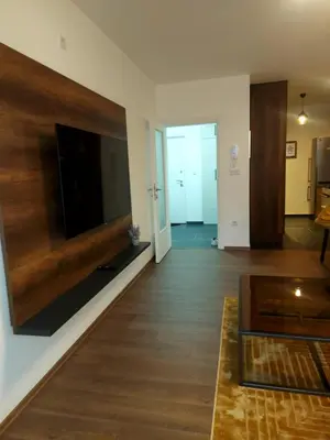 a living room with a flat screen tv on a wall at Pinocchio in Bihać