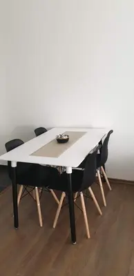 a white table with four chairs around it at Pinocchio in Bihać