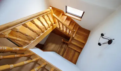 an overhead view of a wooden stairs with a lamp at Guest House Fiona in Bihać