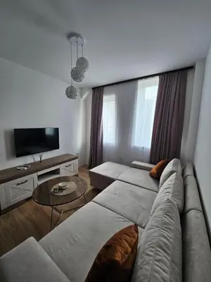 a living room with a couch and a table at Mrakovica 1935 in Prijedor