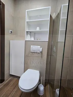 a bathroom with a white toilet in a room at Mrakovica 1935 in Prijedor