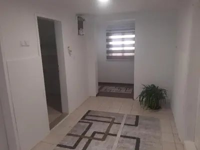 a hallway with a room with a window and a rug at Hasan's apartment - holiday house - vikendica - kuća za odmor - apartman in Visoko