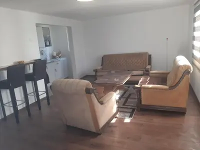 a living room with couches and a table and chairs at Hasan's apartment - holiday house - vikendica - kuća za odmor - apartman in Visoko