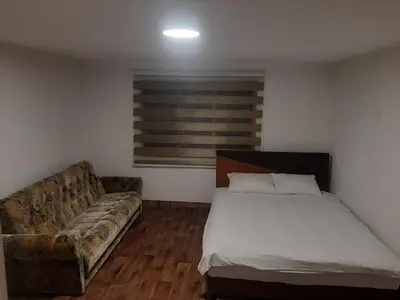 a living room with a bed and a couch at Hasan's apartment - holiday house - vikendica - kuća za odmor - apartman in Visoko