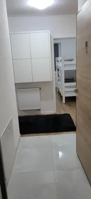 a room with a door and a room with a bed at Comfort in Kiseljak