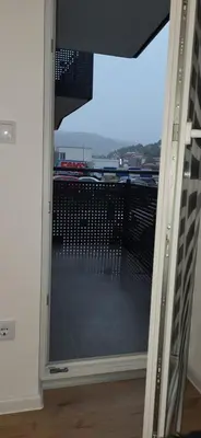 a window with a view of a parking lot at Comfort in Kiseljak