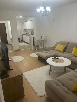 a living room with a couch and a table at Apartman Aura in Travnik