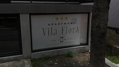 a window of a villa florida store with a tree at Vila Flora Vlašić in Šišava