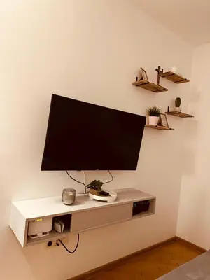 a large flat screen tv on a wall at Studio Apartman Centar 2 in Livno