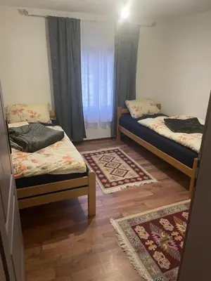a room with two beds and a window at Bungalow House - 5 Rooms in Zolaći