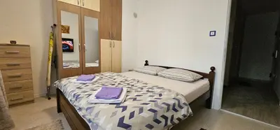 a bedroom with a bed with purple towels on it at Esma in Bihać