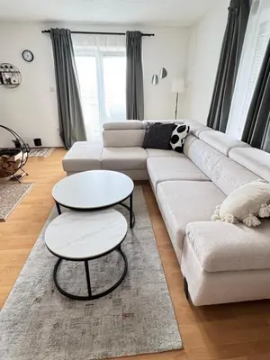 a living room with a couch and a table at Apartman Latice in Tomislavgrad