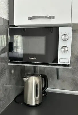 a coffee maker on a counter under a microwave at Apartman Lara Laktasi in Laktaši