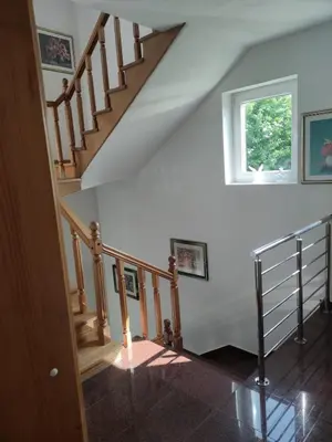 a staircase in a house with a window at Guesthouse Nestoria Living in Banja Luka