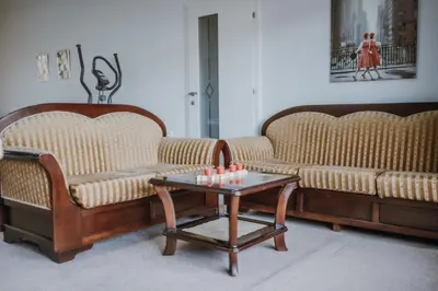 a living room with two couches and a coffee table at MASAL Studio Apartman in Bihać