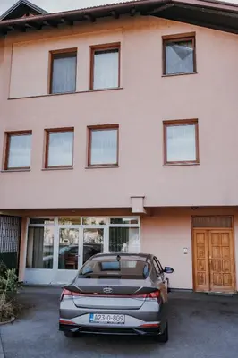 a car parked in front of a building at MASAL Studio Apartman in Bihać