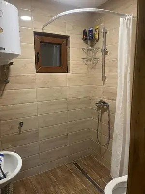 a bathroom with a shower and a sink at Vikendice - Vodenica Jurić in Prozor