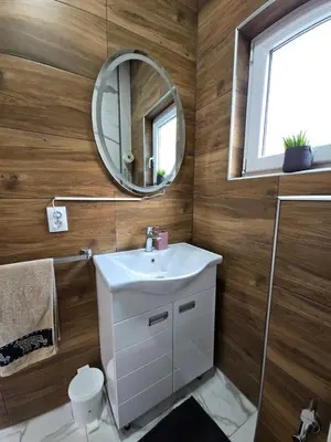 a bathroom with a sink and a mirror at Riverstone Retreat Villa in Jajce