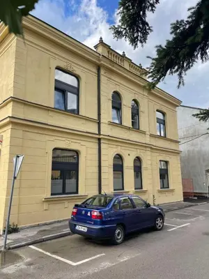 a blue car parked in front of a building at City centar Travnik-free parking in Travnik