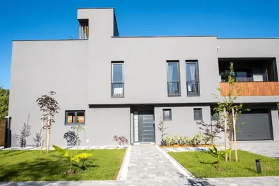 a white house with a courtyard at Villa of Senses in Bihać