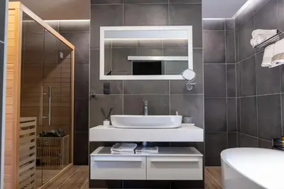 a bathroom with a sink and a mirror at Villa of Senses in Bihać