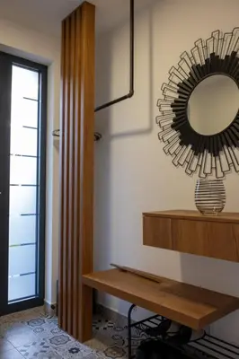 a room with a mirror and a wooden table at Villa of Senses in Bihać