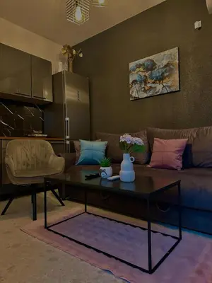 a living room with a couch and a coffee table at Apartman Fin in Jajce
