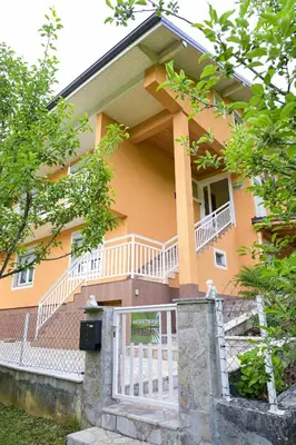 a house with a sign in front of it at Palma in Jajce