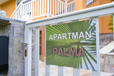 a sign that reads apartment palma in front of a building at Palma in Jajce