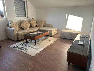 a living room with a couch and a coffee table at Stan na dan Banjaluka in Banja Luka